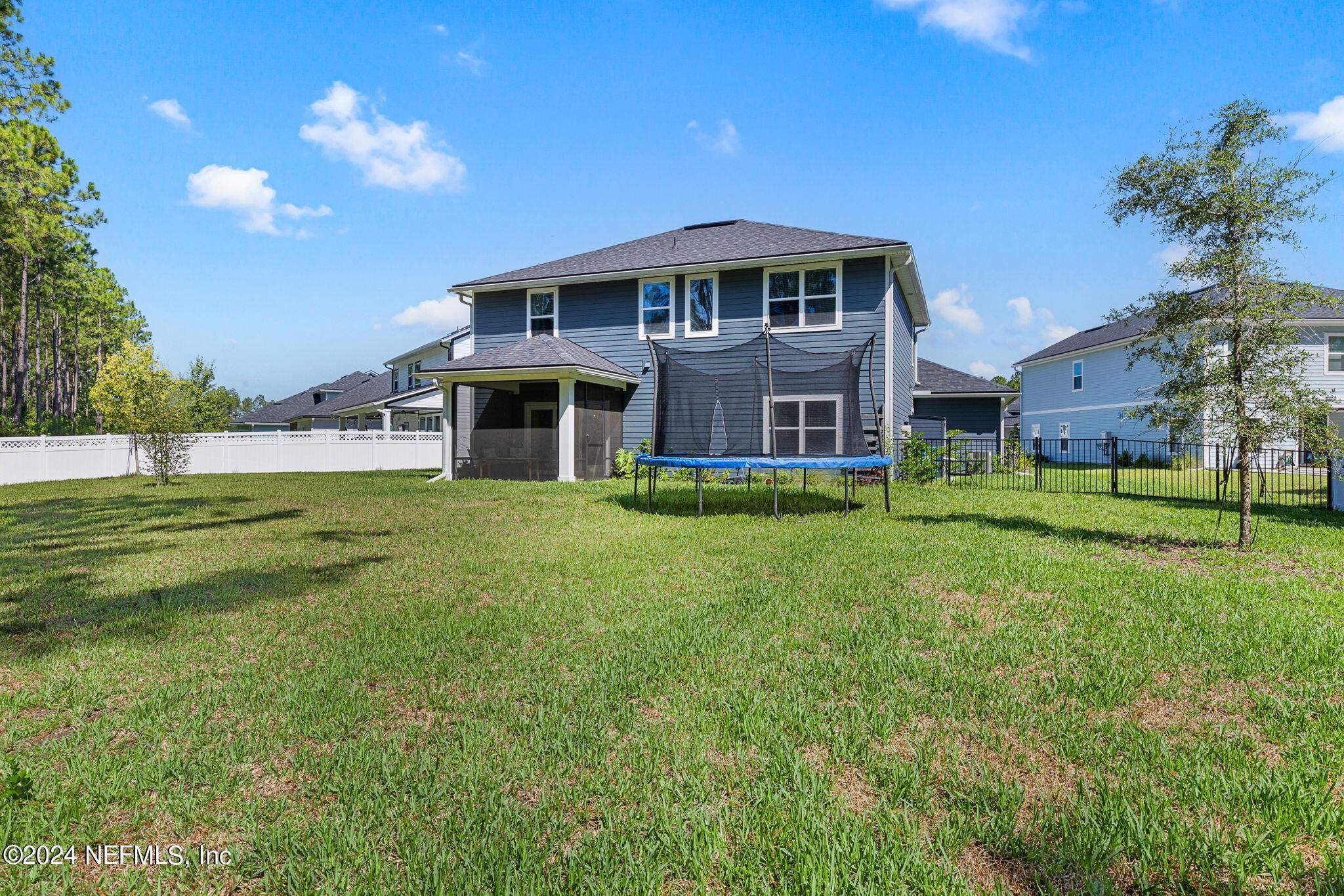 612 Watervale Drive St. Augustine, FL 32092 - Photo 26 of 28 a front view of a house with a garden and yard