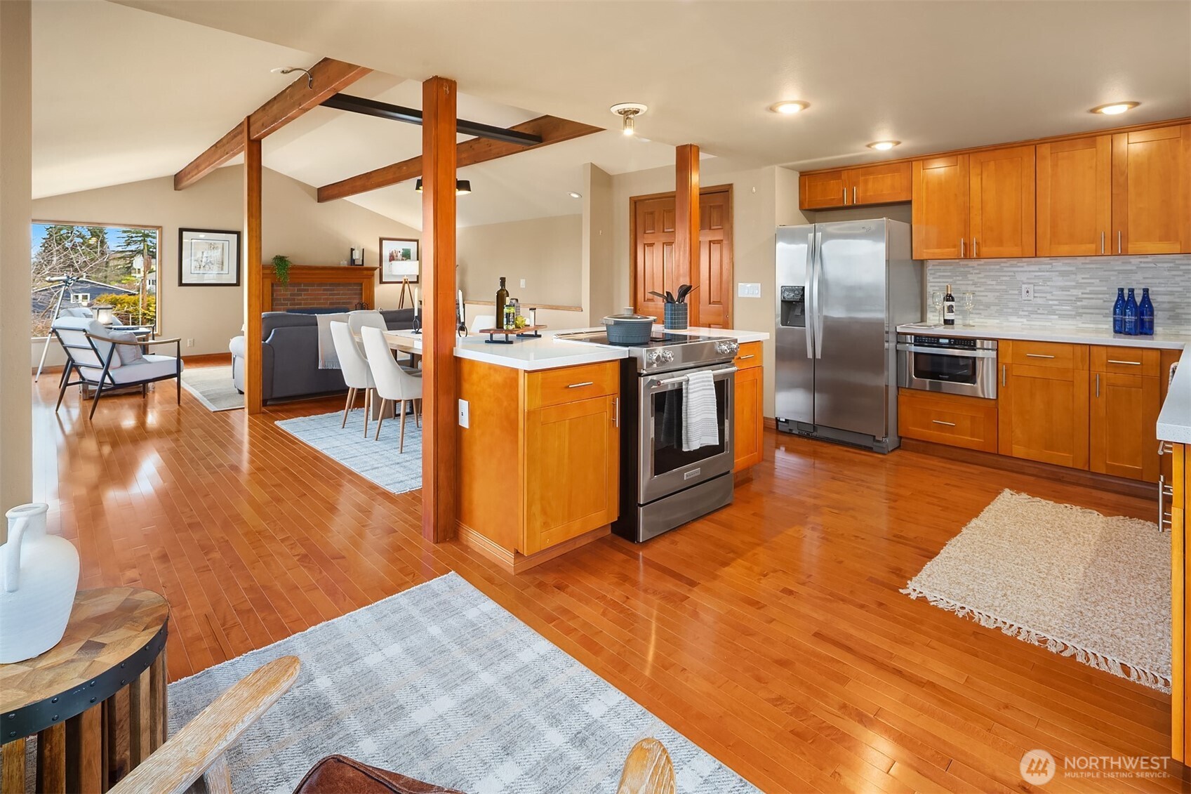 902 7th Avenue South Edmonds, WA 98020 - Photo 11 of 34 a kitchen with stainless steel appliances kitchen island granite countertop a stove a sink and a refrigerator