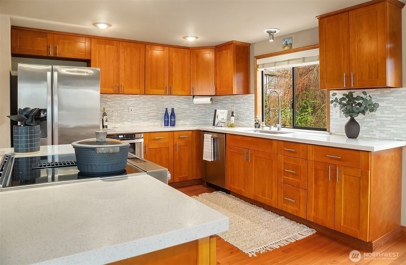 902 7th Avenue South Edmonds, WA 98020 - Photo 14 of 34 a kitchen with stainless steel appliances a sink a stove a refrigerator cabinets and a counter top space
