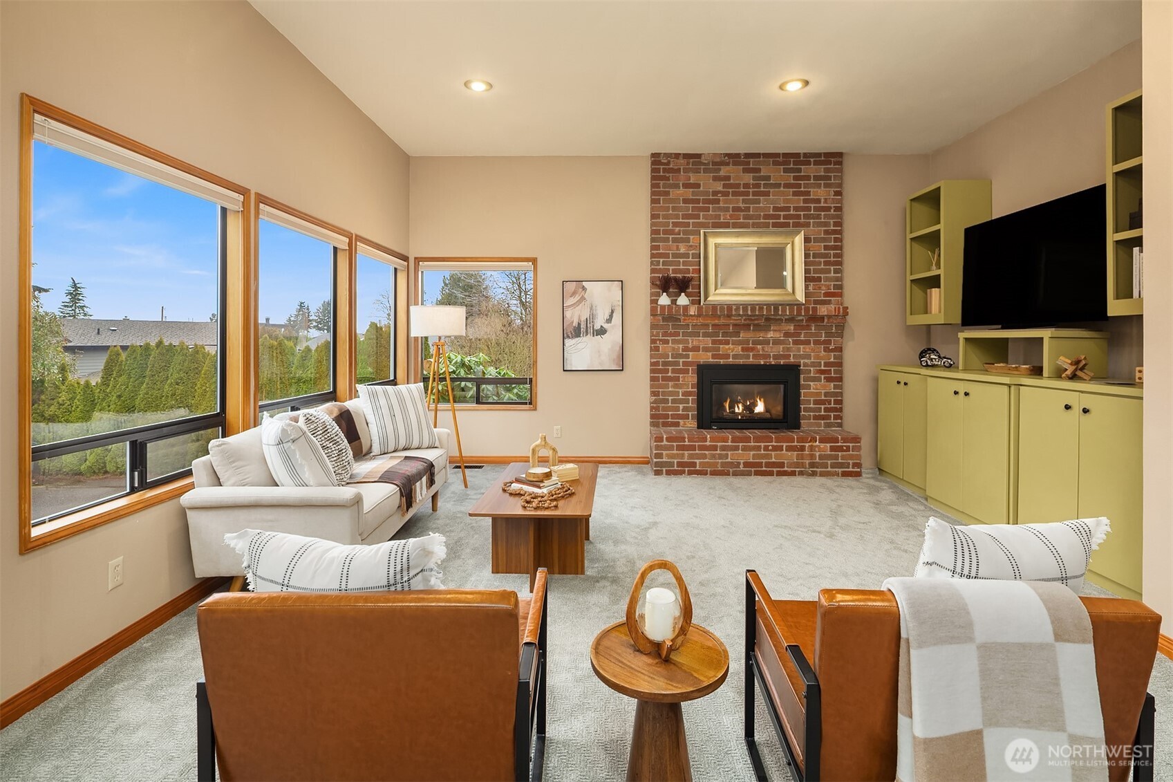902 7th Avenue South Edmonds, WA 98020 - Photo 16 of 34 a living room with furniture a fireplace and a flat screen tv