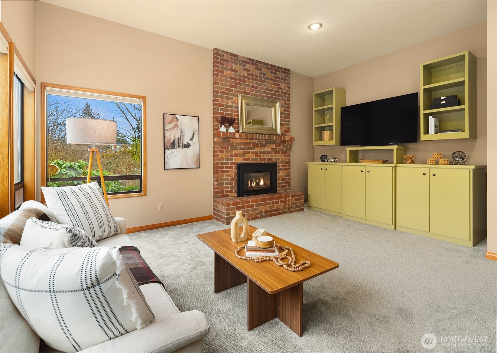 902 7th Avenue South Edmonds, WA 98020 - Photo 17 of 34 a living room with furniture a flat screen tv and a fireplace