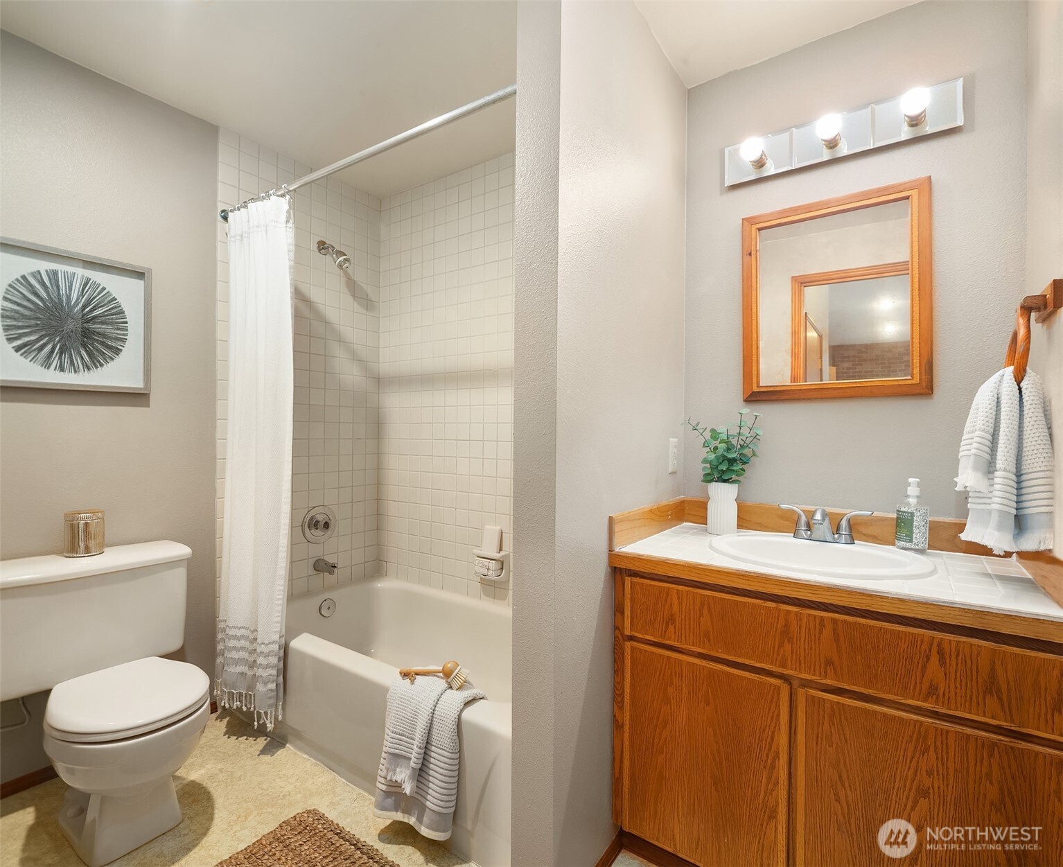 902 7th Avenue South Edmonds, WA 98020 - Photo 22 of 34 a bathroom with a sink toilet and shower