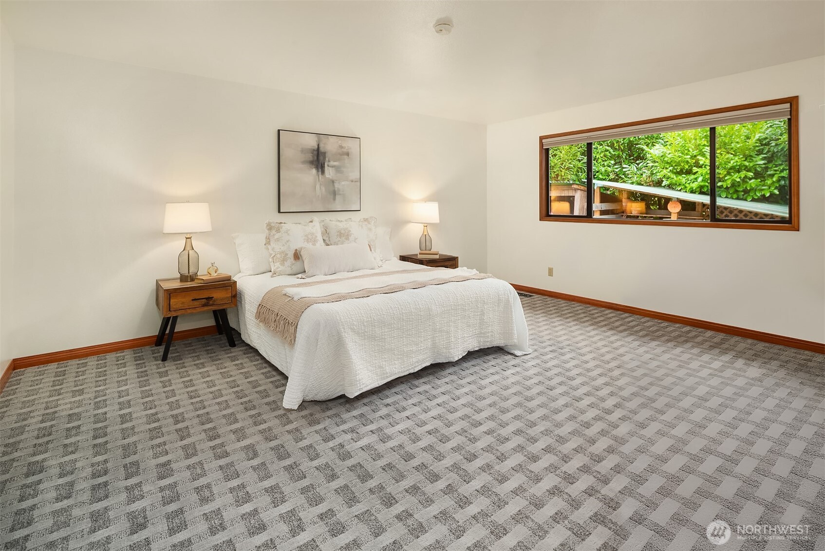 902 7th Avenue South Edmonds, WA 98020 - Photo 23 of 34 a bedroom with a bed and a wall painting