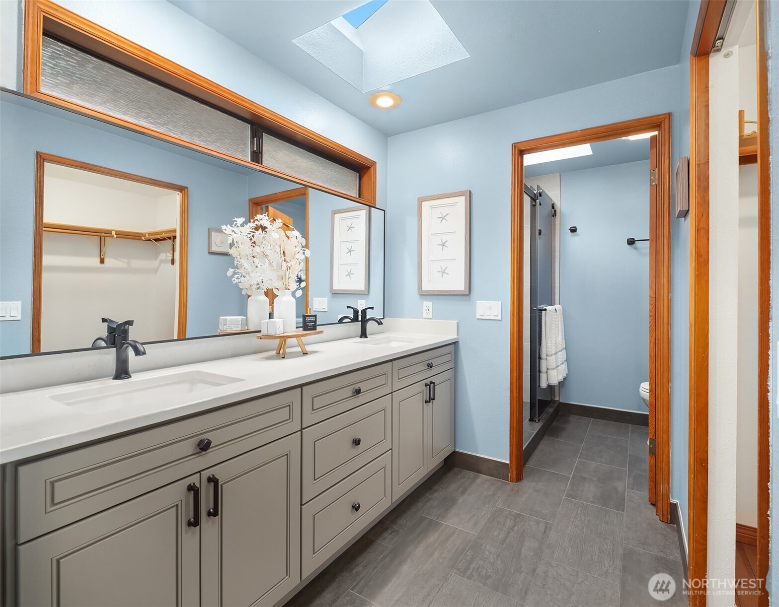 902 7th Avenue South Edmonds, WA 98020 - Photo 25 of 34 a spacious bathroom with a granite countertop sink mirror and a