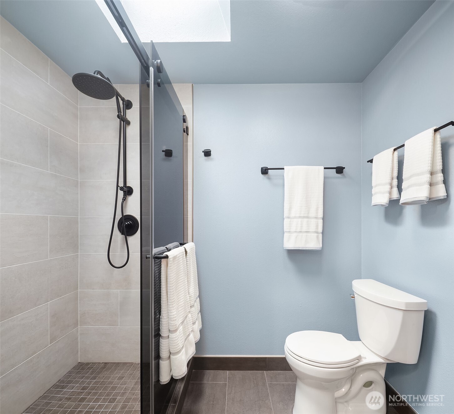 902 7th Avenue South Edmonds, WA 98020 - Photo 26 of 34 a bathroom with a granite countertop shower a toilet and sink