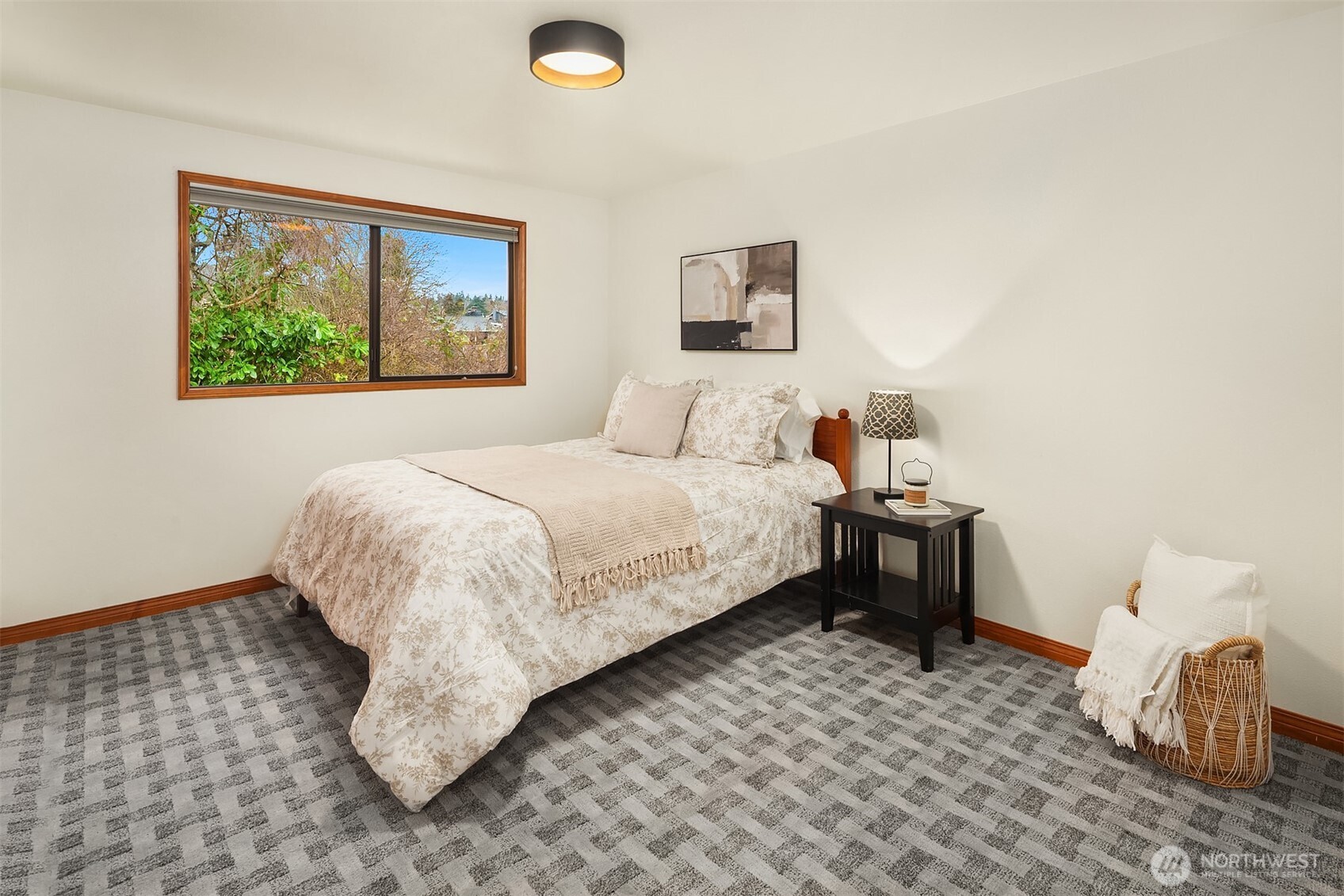 902 7th Avenue South Edmonds, WA 98020 - Photo 29 of 34 a bedroom with a bed and a painting on the wall