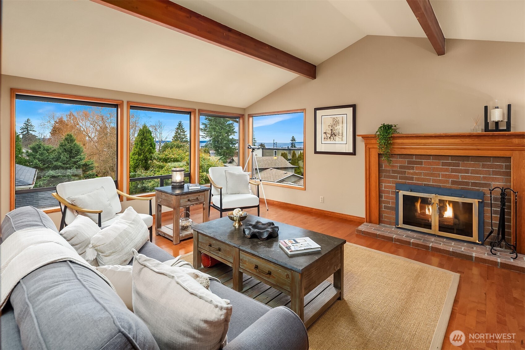 902 7th Avenue South Edmonds, WA 98020 - Photo 3 of 34 a living room with furniture a fireplace and a large window