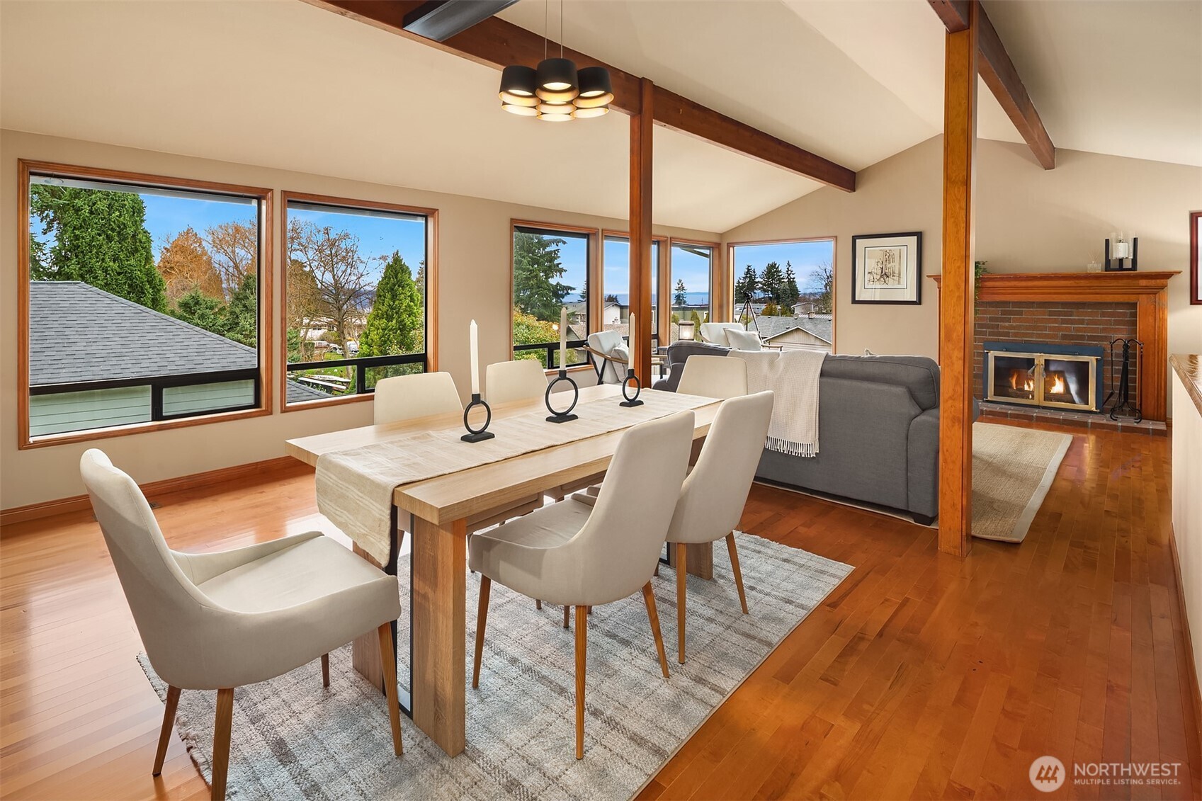 902 7th Avenue South Edmonds, WA 98020 - Photo 9 of 34 a dining room with furniture a large window and wooden floor