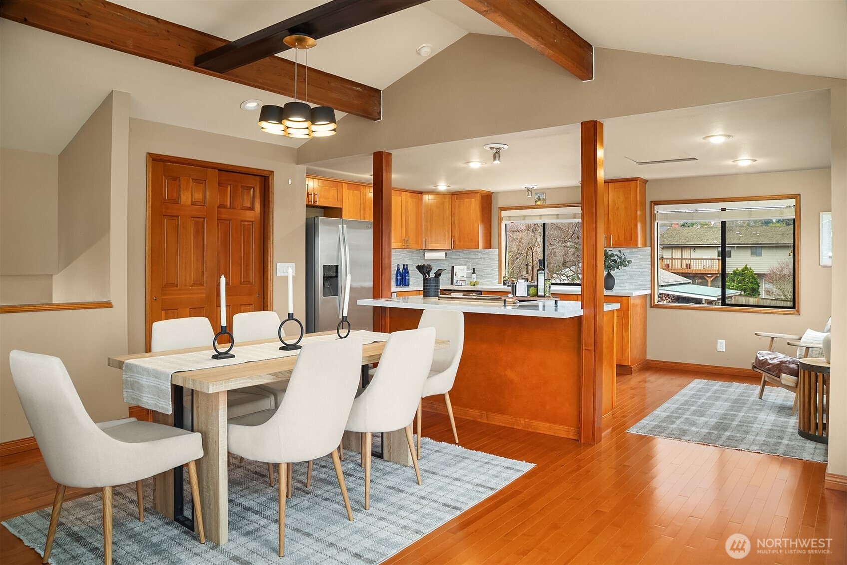 902 7th Avenue South Edmonds, WA 98020 - Photo 10 of 34 a dining hall with stainless steel appliances kitchen island granite countertop a dining table and chairs