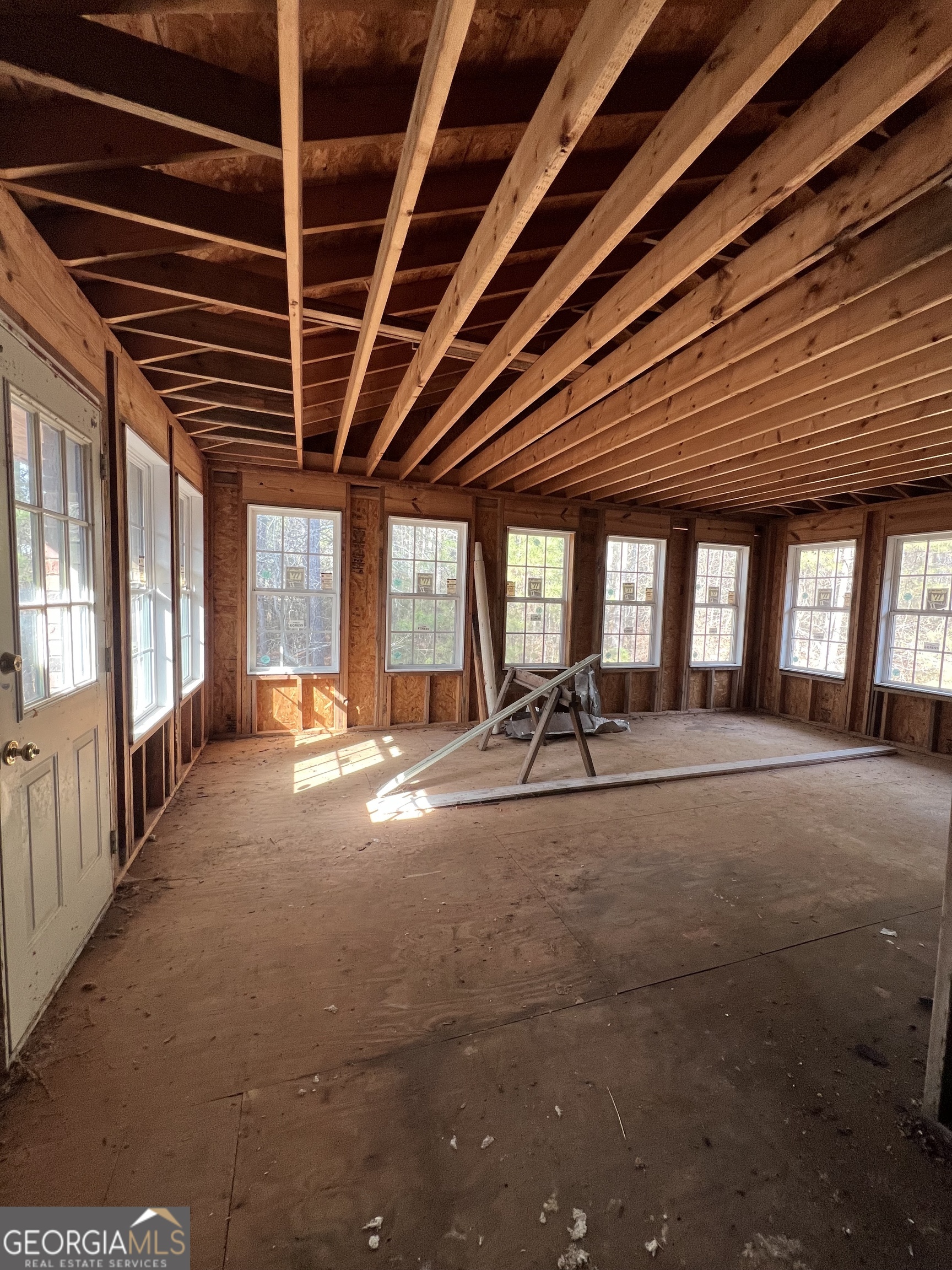 2282 Fairburn Road Douglasville, GA 30135 - Photo 13 of 14 a view of an empty room with wooden floor and windows