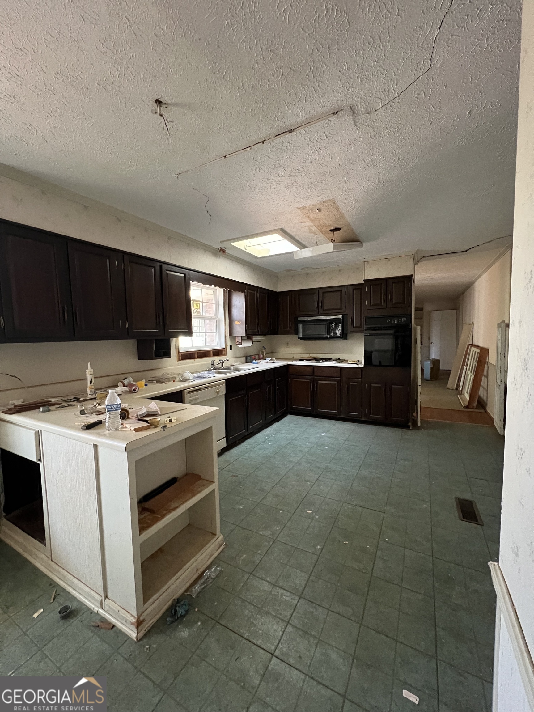 2282 Fairburn Road Douglasville, GA 30135 - Photo 2 of 14 a kitchen with a stove and a refrigerator