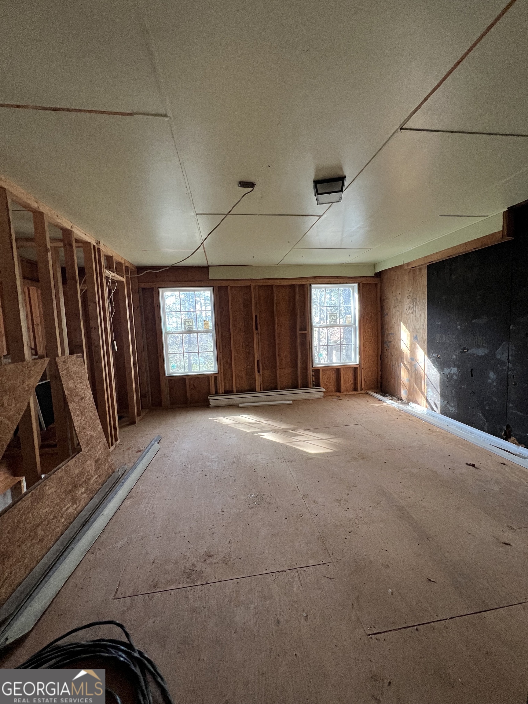 2282 Fairburn Road Douglasville, GA 30135 - Photo 5 of 14 a view of an empty room with window and stairs