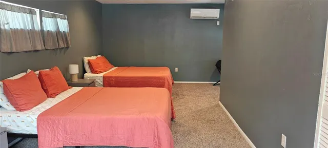 a bedroom with a bed and a walk in closet