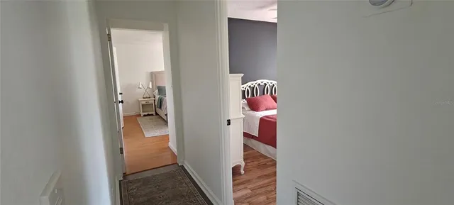 a kitchen with a table chairs refrigerator and cabinets