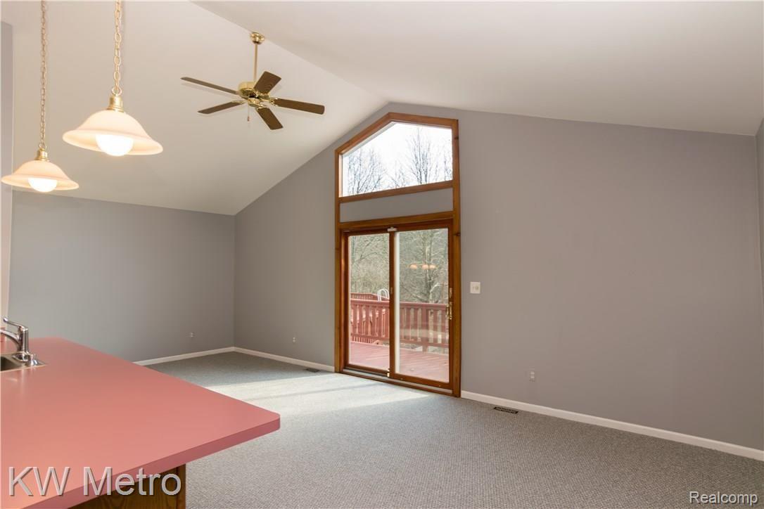 2211 West Wardlow Road Highland, MI 48357 - Photo 34 of 53 In-law living w/ doorwall to back/pool.