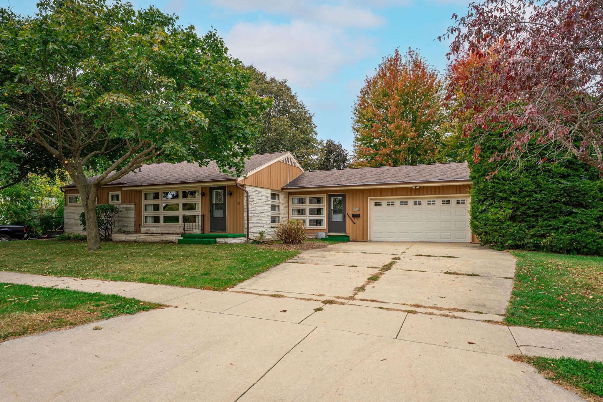 1205 7th Avenue Belvidere, IL 61008 - Photo 1 of 33 a front view of a house with a garden