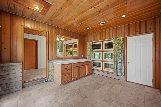 a spacious en suite bathroom with a large tub and shower