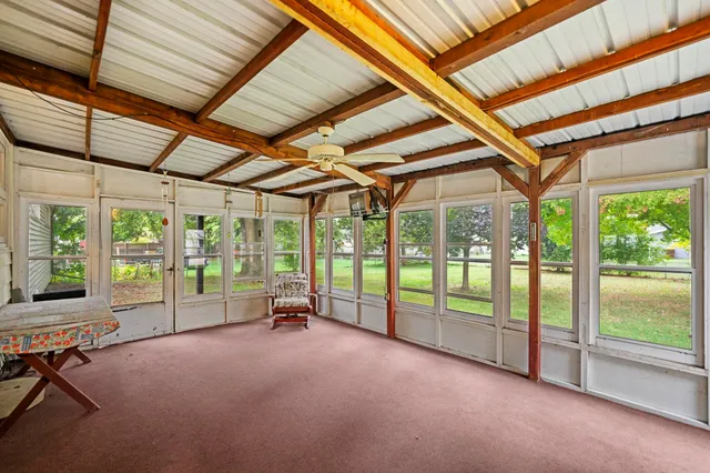 a view of an empty room with a balcony