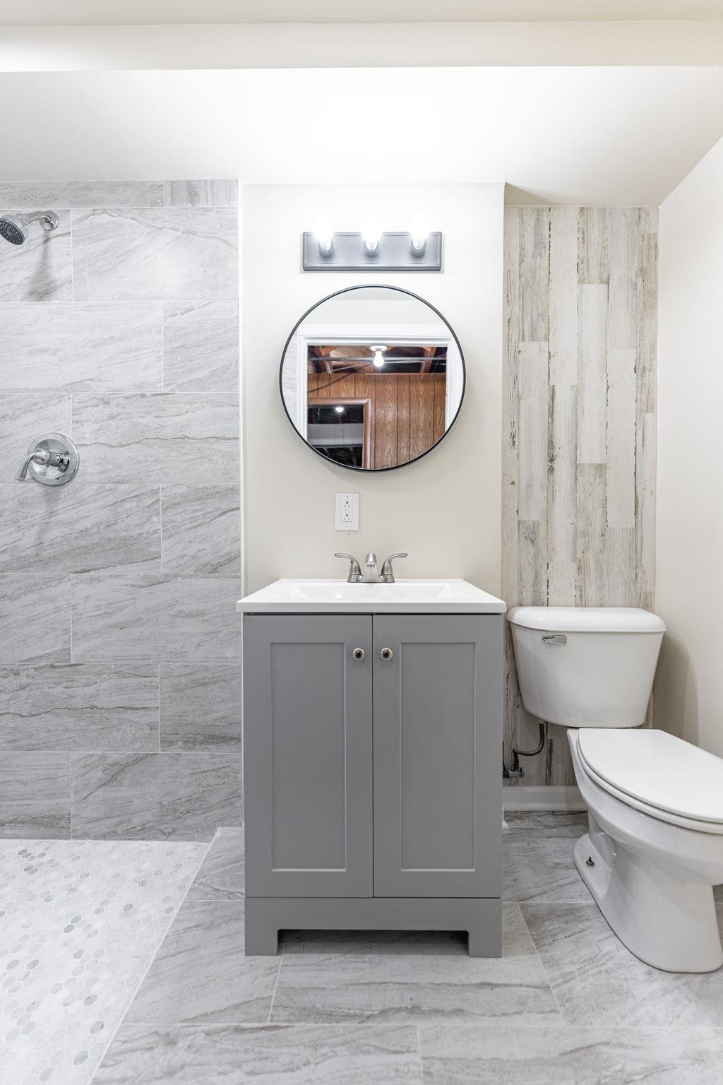 1205 7th Avenue Belvidere, IL 61008 - Photo 25 of 33 a bathroom with a sink toilet and mirror