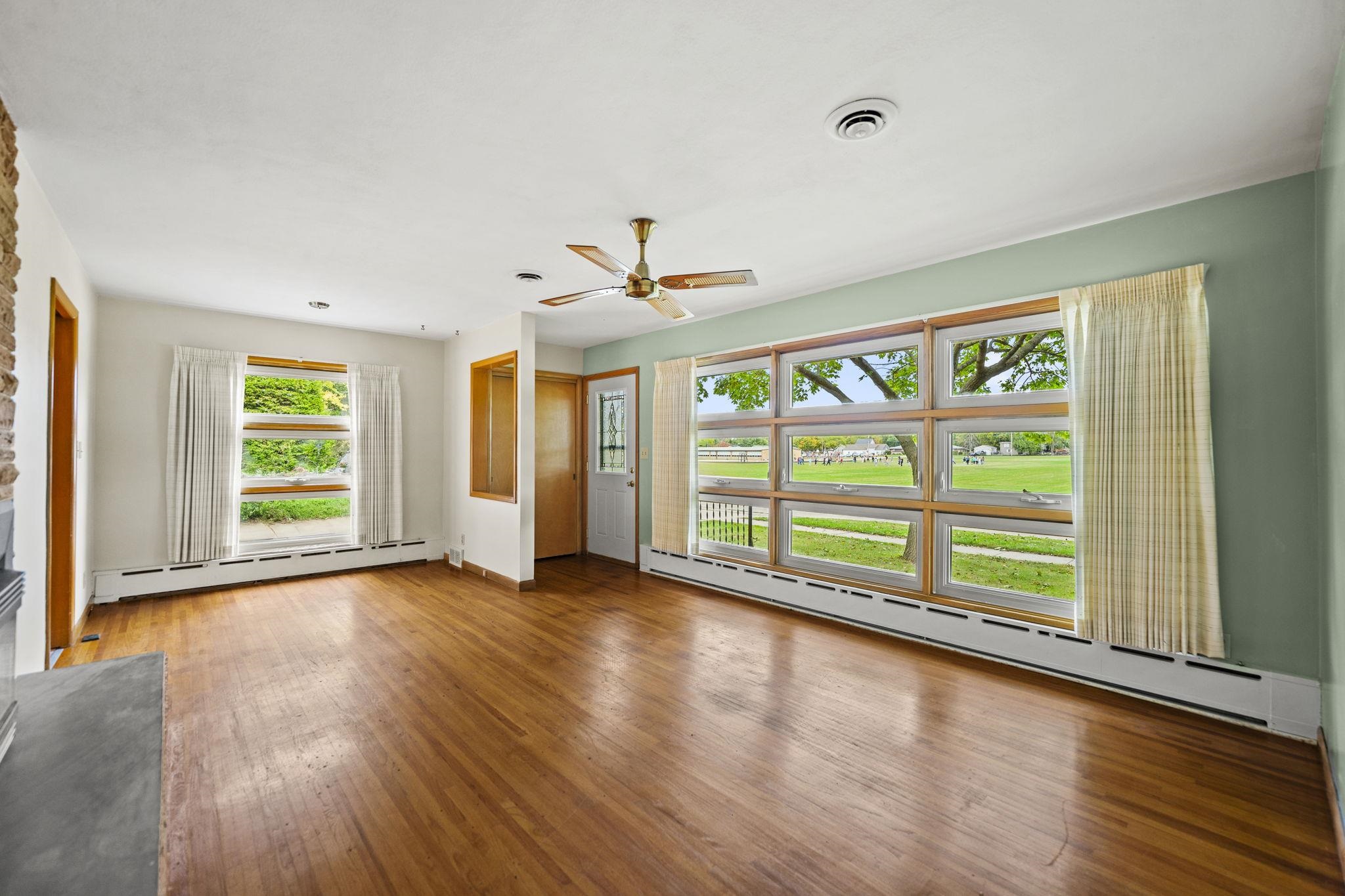 1205 7th Avenue Belvidere, IL 61008 - Photo 4 of 33 wooden floor in an empty room with a window
