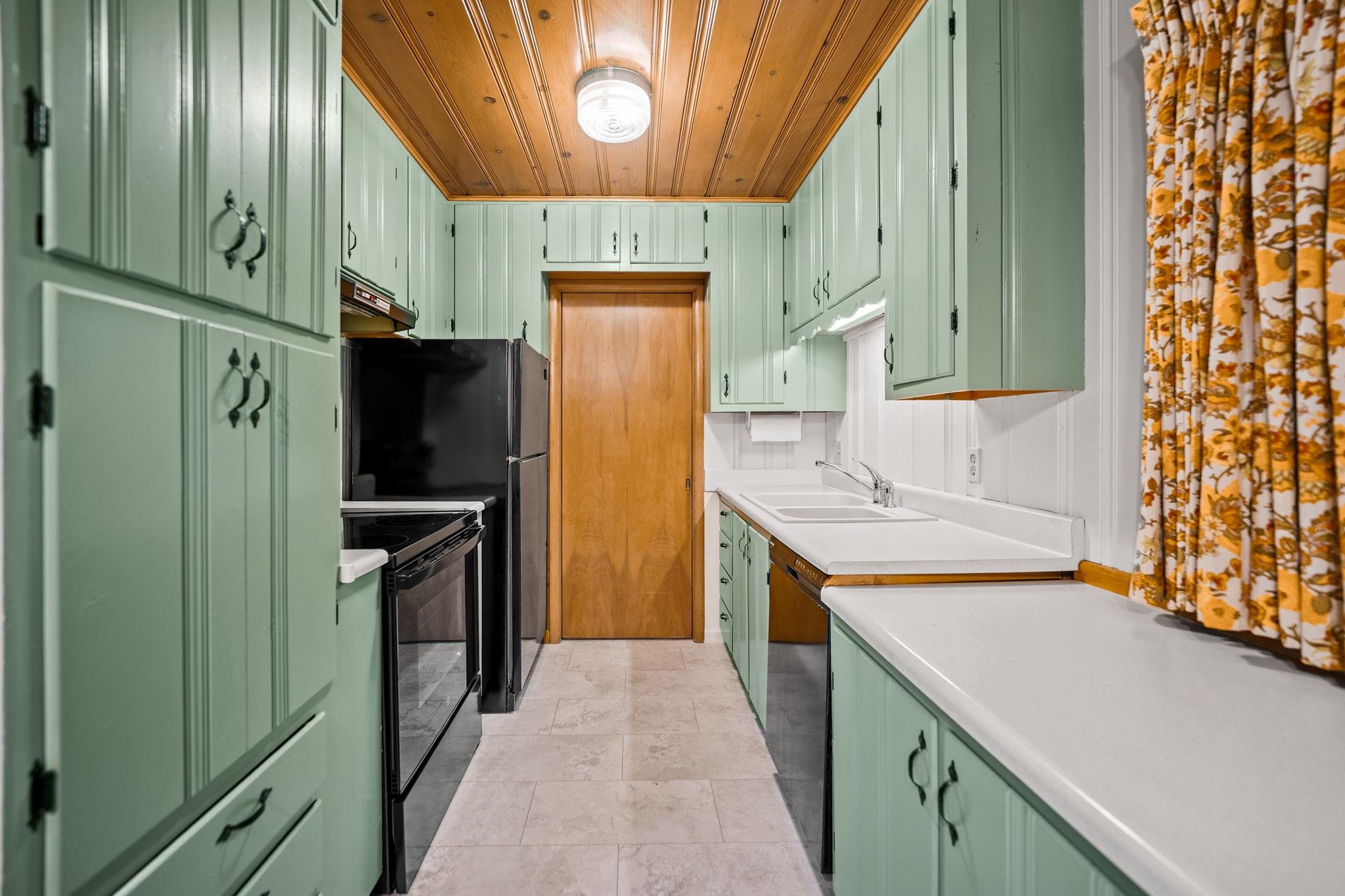 1205 7th Avenue Belvidere, IL 61008 - Photo 8 of 33 a kitchen with a refrigerator and a sink