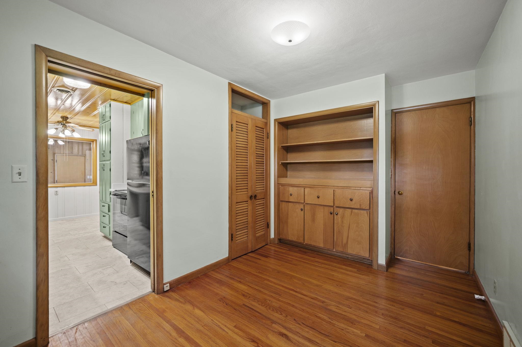 1205 7th Avenue Belvidere, IL 61008 - Photo 9 of 33 an empty room with wooden floor closet and windows