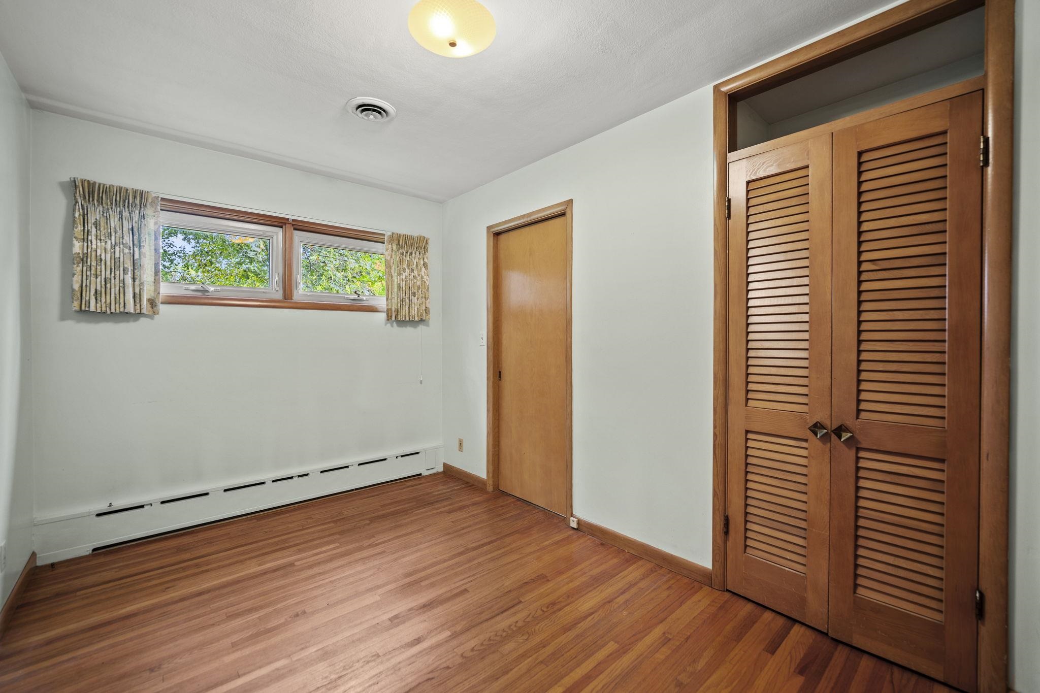 1205 7th Avenue Belvidere, IL 61008 - Photo 10 of 33 a view of empty room with wooden floor and fan