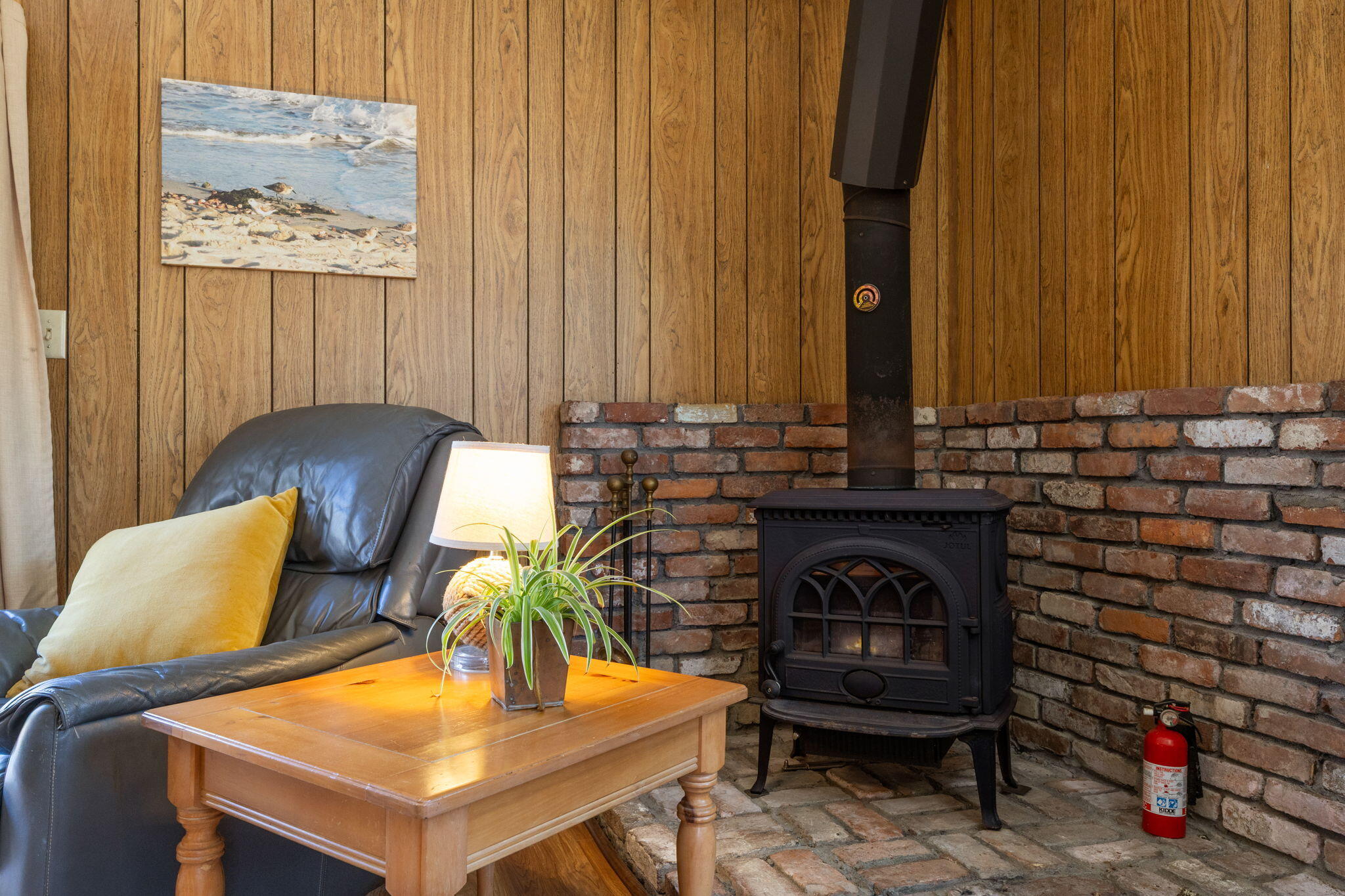 60 Long Avenue, Unit A Wellfleet, MA 02667 - Photo 13 of 28 a living room with furniture and a fireplace
