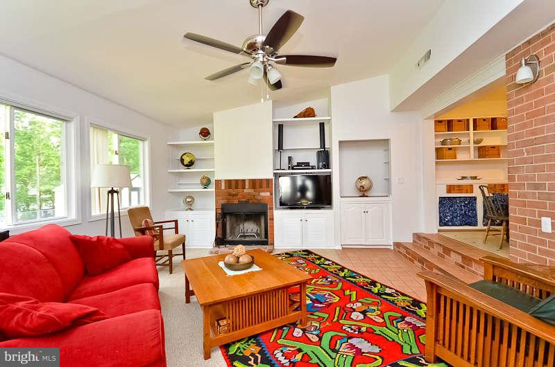 6932 Conservation Drive Springfield, VA 22153 - Photo 13 of 26 Family Room with Built-in Shelves & Fireplace