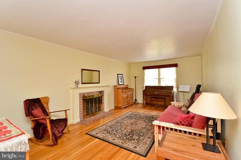 6932 Conservation Drive Springfield, VA 22153 - Photo 6 of 26 Living Room with Wood Burning Fireplace