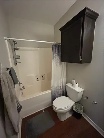 a bedroom with a bed and a ceiling fan