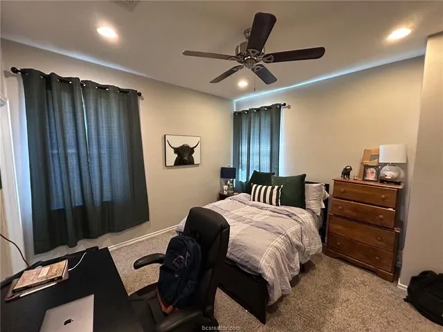 a kitchen with a sink stove and wooden cabinets