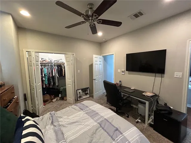 a view of a livingroom with furniture and a window