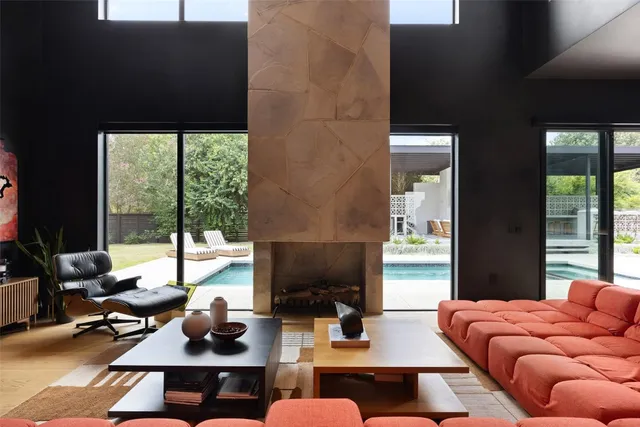 a spacious bedroom with a bed and a flat screen tv