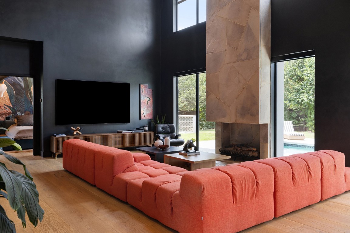 204 Westbrook Drive Austin, TX 78746 - Photo 13 of 40 a spacious bedroom with a bed and a flat screen tv