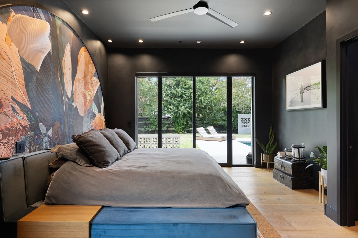 204 Westbrook Drive Austin, TX 78746 - Photo 16 of 40 a bedroom with a bed and a large window