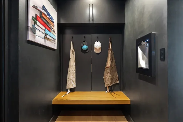 a view of staircase with white walls and potted plants
