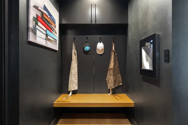 a view of staircase with white walls and potted plants