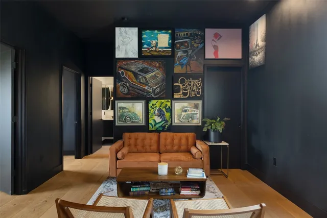 a room with furniture bookshelf and a flat screen tv