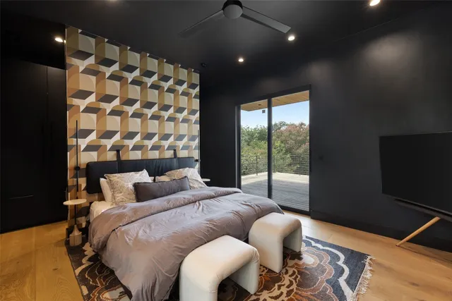 a bathroom with a sink a toilet a mirror and shower