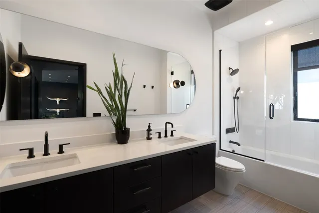 a bedroom with a bed chair and window