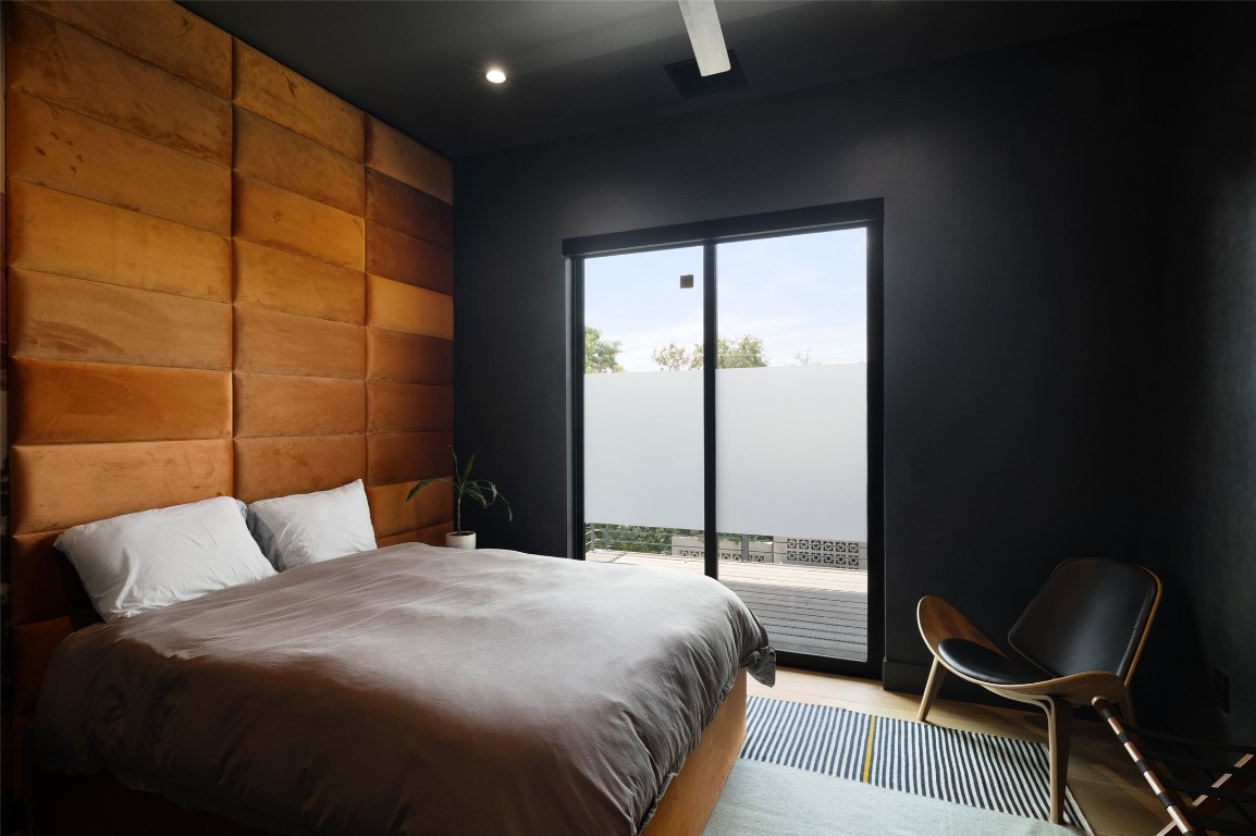 204 Westbrook Drive Austin, TX 78746 - Photo 32 of 40 a bedroom with a bed chair and window