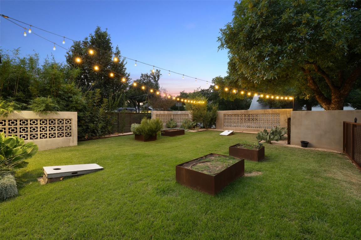 204 Westbrook Drive Austin, TX 78746 - Photo 39 of 40 a view of a table and chairs in the garden
