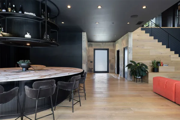 a dinning area with furniture and chandelier