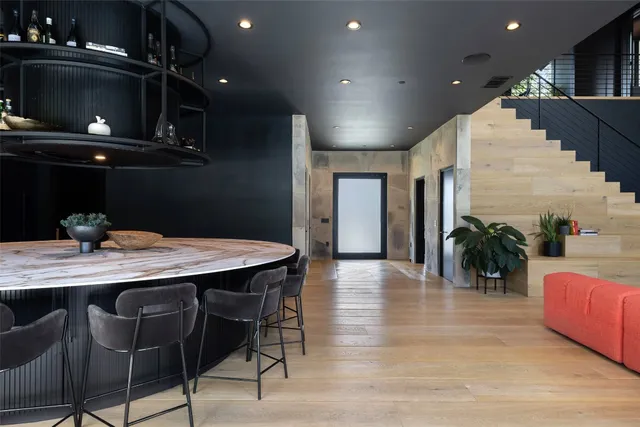 a dinning area with furniture and chandelier