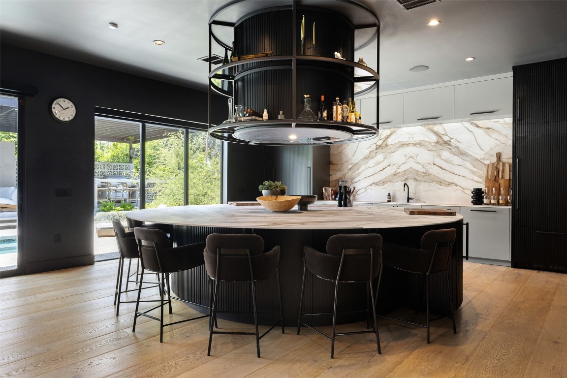 204 Westbrook Drive Austin, TX 78746 - Photo 7 of 40 a kitchen with a table and chairs in it