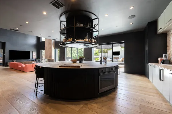 a kitchen with a sink and cabinets