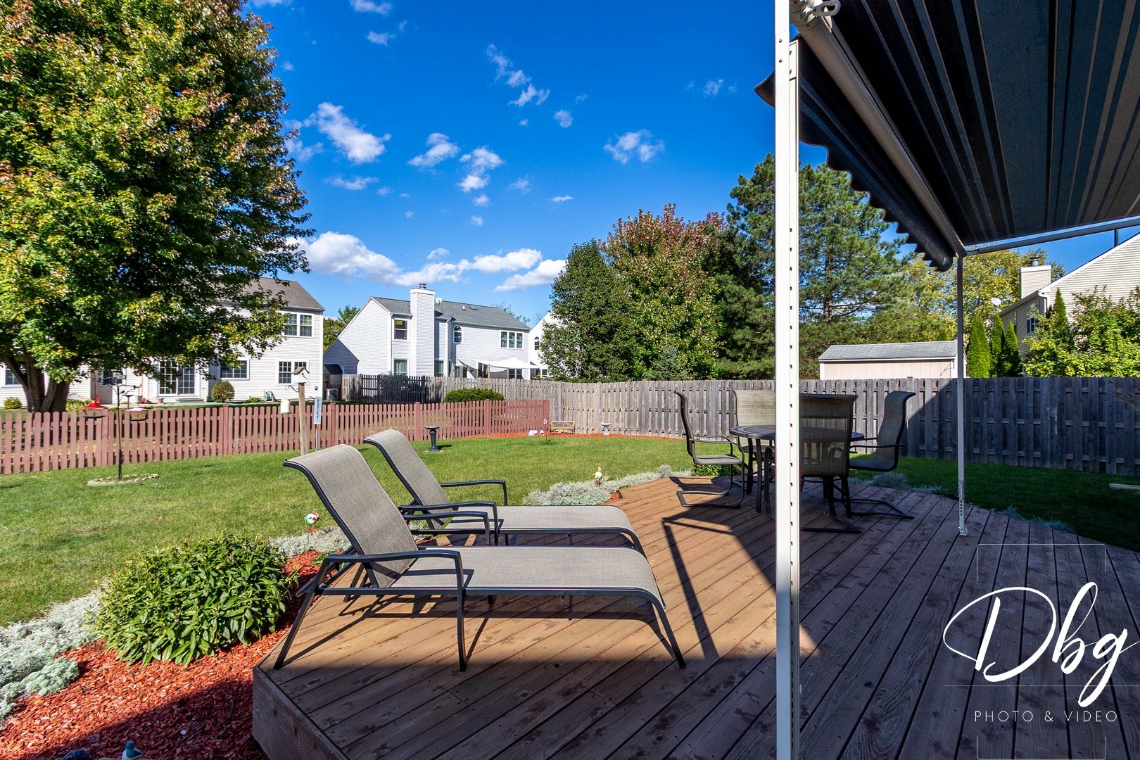 252 Carters Grove Court Grayslake, IL 60030 - Photo 43 of 69 a view of a patio with table and chairs potted plants with wooden floor and fence