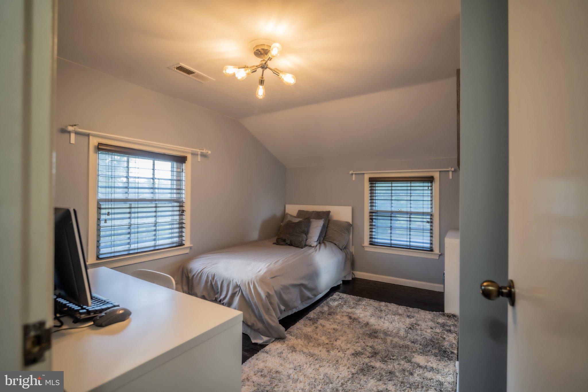 430 Pine Grove Road Bluemont, VA 20135 - Photo 41 of 58 a bedroom with a bed a couch and a window