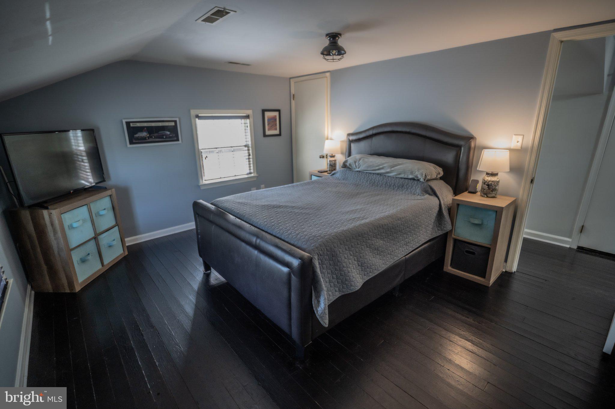 430 Pine Grove Road Bluemont, VA 20135 - Photo 43 of 58 a bedroom with a bed and wooden floor